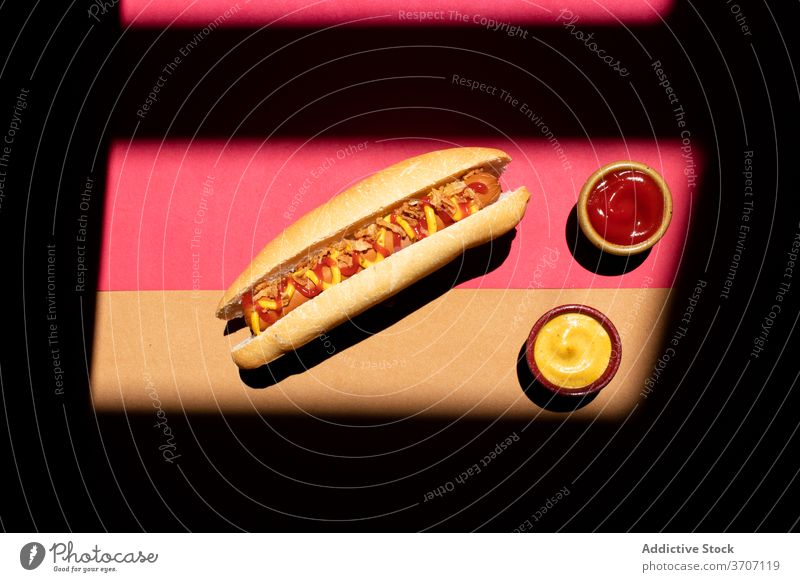 Frankfurt hot dog with mustard and ketchup closeup culinary zigzag sandwich weiner background frankfurter sausage snack lunch bun american food dinner grilled