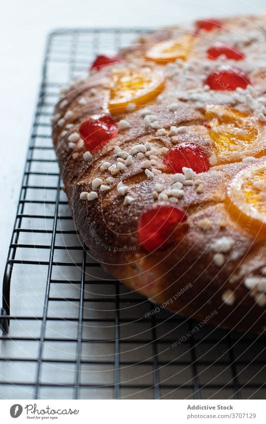 Coca de San Juan cake decorated with orange and cheery traditional cake traditional bakery cherry fruit pine nuts custard recipe baked cava gastronomy