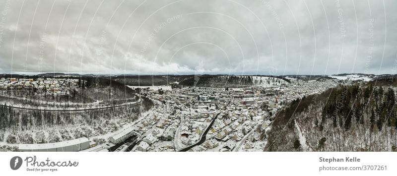 Albstadt panorama from above, snow city at the Schwaebische Alb of germany in white powdered winter landscape aerial scene from a drone. schwaebische alb