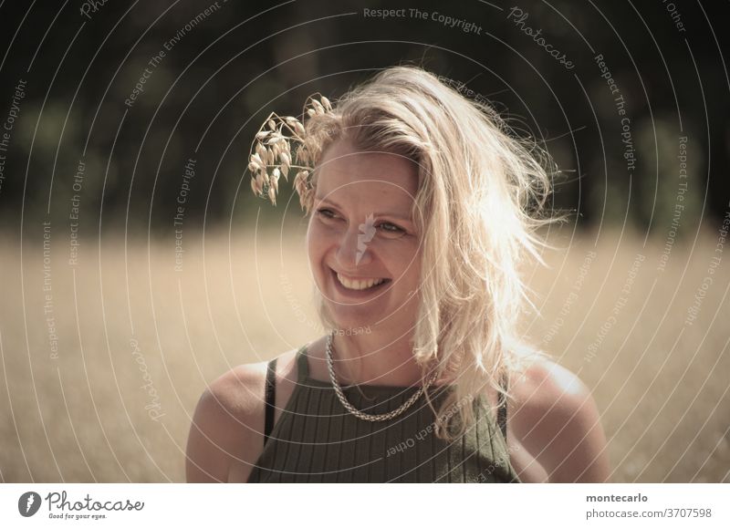 young lady with a seed in her hair in a cornfield Face Mouth Colour photo Day Reliability Friendliness Woman Moody Exterior shot portrait Authentic Life