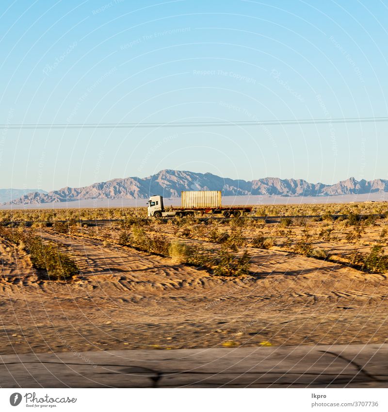 in iran   mountain landscape rock desert nature persia travel sky asia stone scenic hill valley tourism view road panorama green transport scenery beautiful