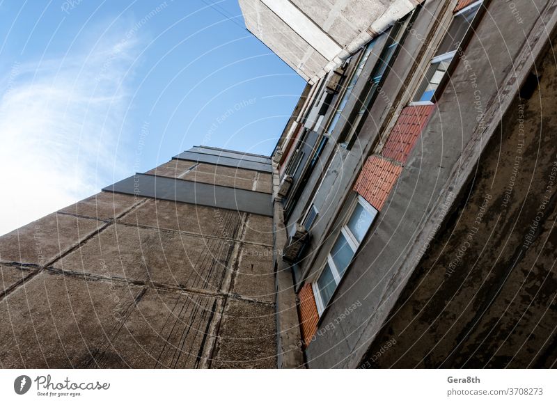 old gray high building in Uraine Donbass Dobnbass Soviet Ukraine abandoned abstract architecture area background black blue bottom view city conflict