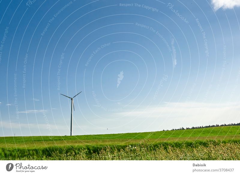 Wind turbine in the field. Wind power energy concept wind generator industry electricity alternative landscape green clean nature renewable environment