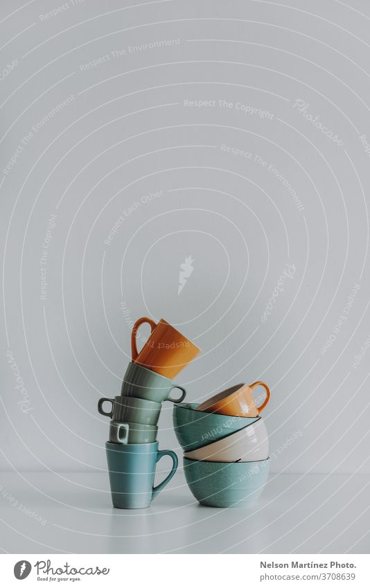 Minimalist and abstract composition with cups and deep plates. They are in a white background. copy space think straight idea concept minimal creative pastel