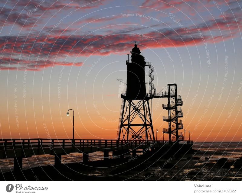 Lighthouse near Dorum-Neufeld wursterland North Sea watt Evening evening sky Sky Germany brd Europe Tower evening mood Ocean wurster north sea coast