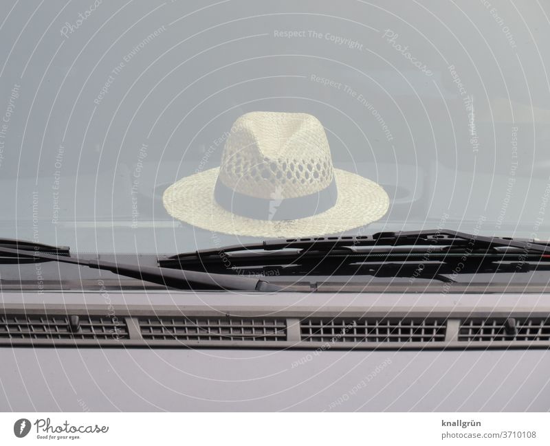 A Borsalino lying on the front shelf of a car Hat Headwear Fashion Style Clothing Accessory Design already Elegant fedora Borsalino hat Lifestyle Human being