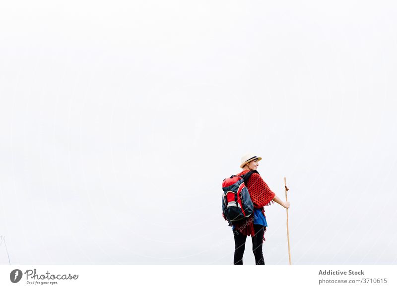 Traveler with trekking stick enjoying freedom hiker backpacker woman traveler happy pilgrimage nature smile activity camino de santiago spain female asturias