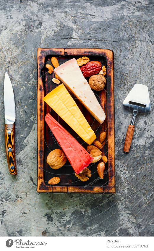 Delicious cheese on the table slice food dairy piece gouda assorted various healthy swiss kinds piece cheese assortment appetizer delicious snack product cut