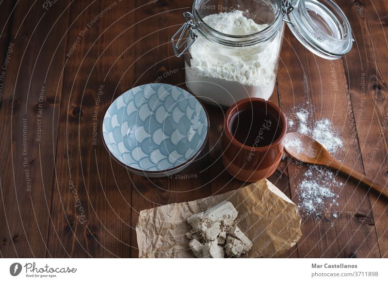 Ingredients and containers for making sourdough Bakery concept. Copy space. Top view. Yeast Water Bowl Paper Sourdough Dough Knead Flour Processing Homemade