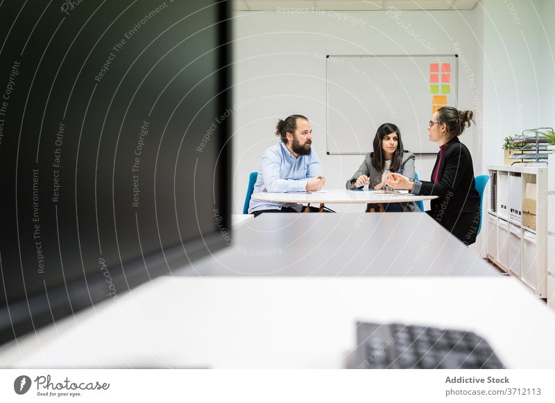 Group of coworkers having meeting in modern office colleague business team group take note workplace busy write professional manager job organization analyze