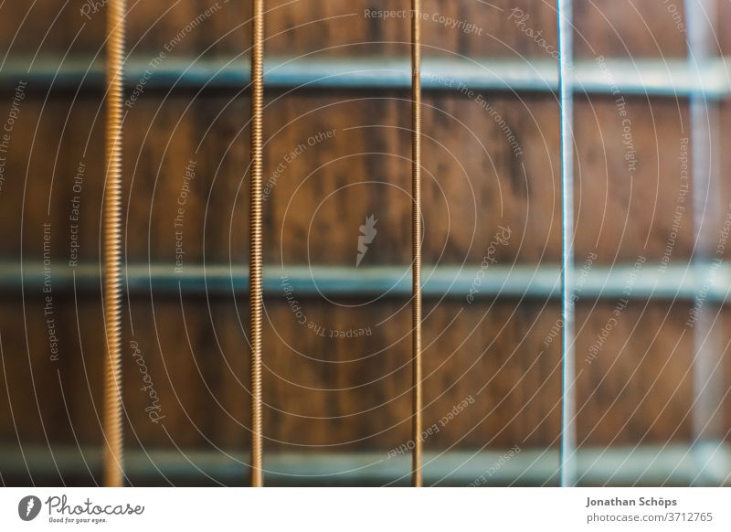 Macro guitar strings of a guitar detail Guitar Interior shot Learn to play Playing the instrument macro Music Musical instrument Music tuition Close-up