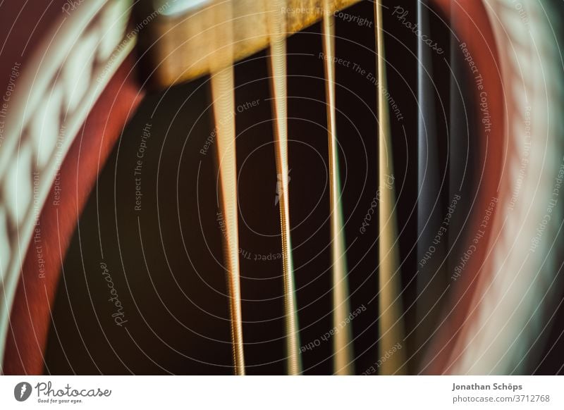 Macro guitar strings of a guitar detail Guitar Interior shot Learn to play Playing the instrument macro Music Musical instrument Music tuition Close-up