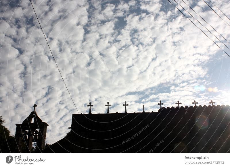 Cemetery crosses as silhouette against clouds sky cemetery wall weaker Death Tombstone Grave Religion and faith Transience Funeral Belief Old Crucifix Crosses