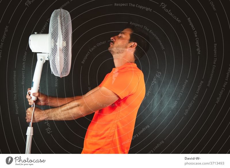 Man holds fan in hands Fan ardor perspire warm Hot Summer Sportsperson Athletic Warmth Air