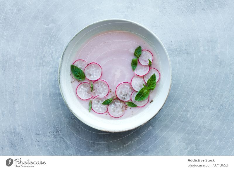 Vegetarian radish soup with green herbs vegetarian vegetable food fresh basil cold bowl meal nutrition healthy tasty cuisine organic homemade delicious natural