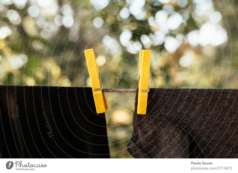 Clothes on the clothesline Clothesline Clothing Clothes peg Clothespin Yellow Exterior shot Holder Washing wash Household White Washing day Clean Laundry Dry