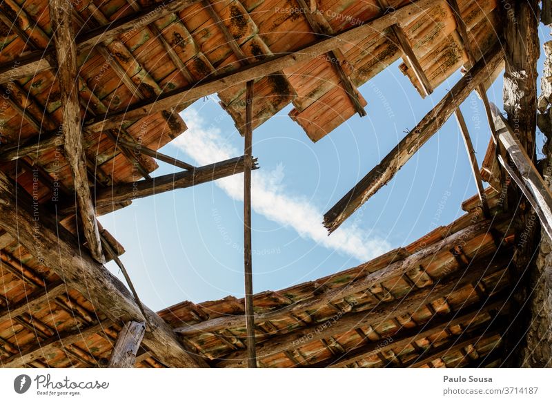 Hole in the roof Roof Roofing tile Ruin Ruined ruins Abandoned Detail Brick Old Blue Architecture House (Residential Structure) Red Deserted Building Sky Stone