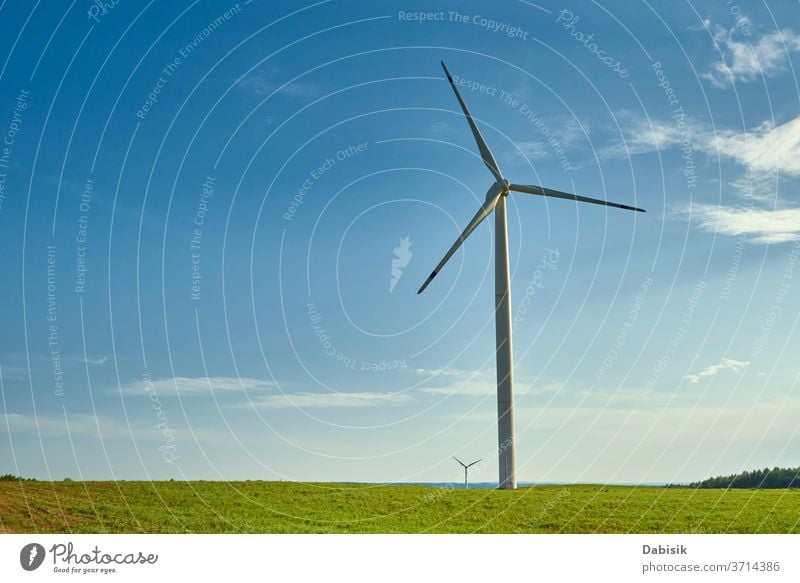 Wind turbine in the field. Wind power energy concept wind generator industry electricity alternative landscape green clean nature renewable environment