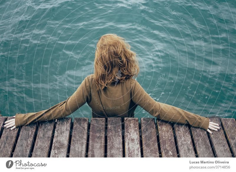 blonde Girl looking to the ocean sea inspiration girl reflection reflexive ocean water cold suicide depression yellow september