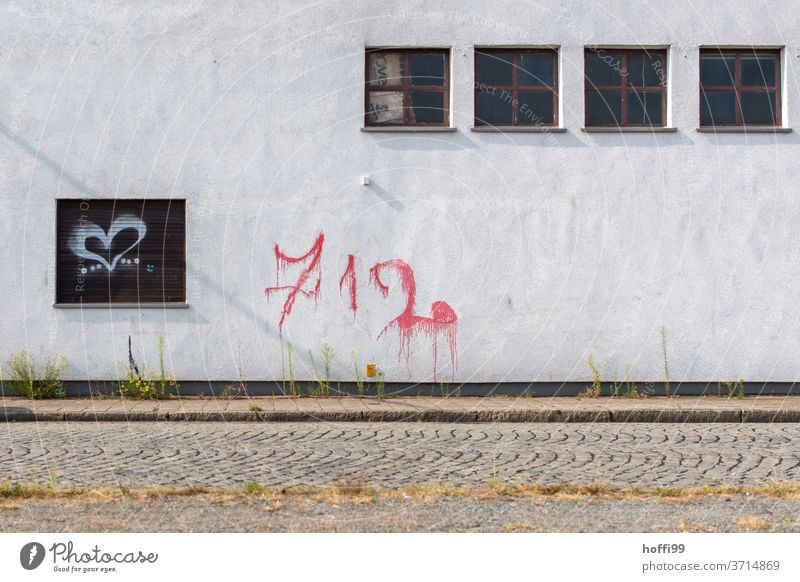 four windows with graffiti Graffiti Window Wall (building) Heart Heart-shaped Emotions Gray dreariness Minimalistic Wall (barrier) Love Facade Sign Red Decline