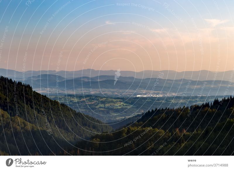 Panorama at sunset from the mountains of the Black Forest near Gersbach over the Wehratal and the city of Wehr towards the Swiss Alps Europe Germany alps