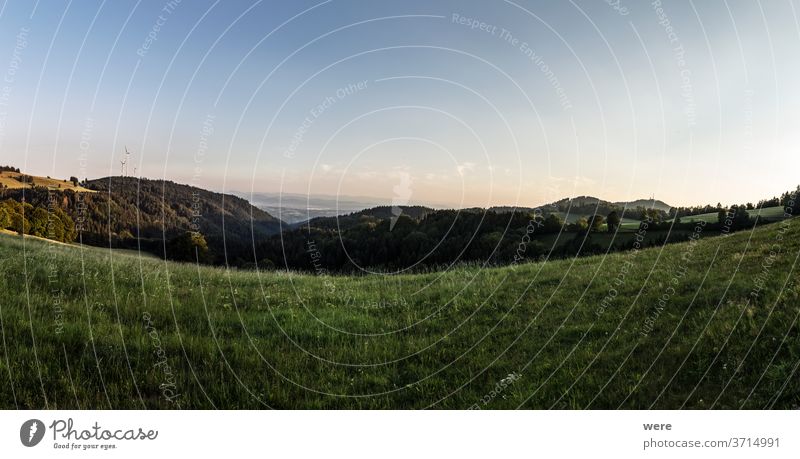 Panorama at sunset from the mountains of the Black Forest near Gersbach over the Wehratal and the city of Wehr towards the Swiss Alps Europe Germany alps