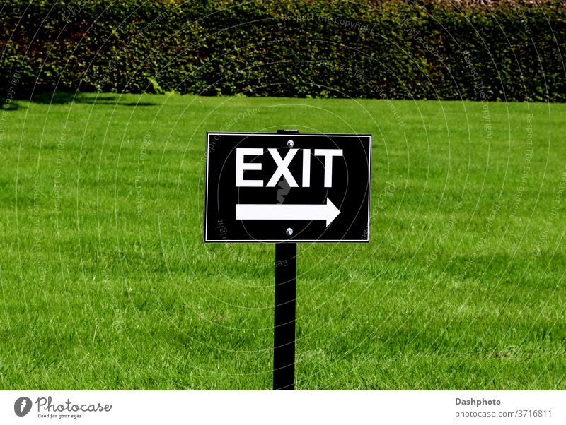 Black and White Exit Sign at a Country Estate Car Park attraction event gathering sign signboard signpost exit arrow black white lettering writing printing