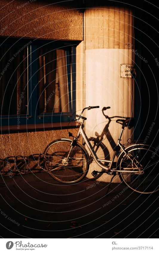 a bicycle Bicycle Wheel conceit Sunlight Esthetic Means of transport Shadow Light Day standstill Parking Parking lot Exterior shot Colour photo Deserted