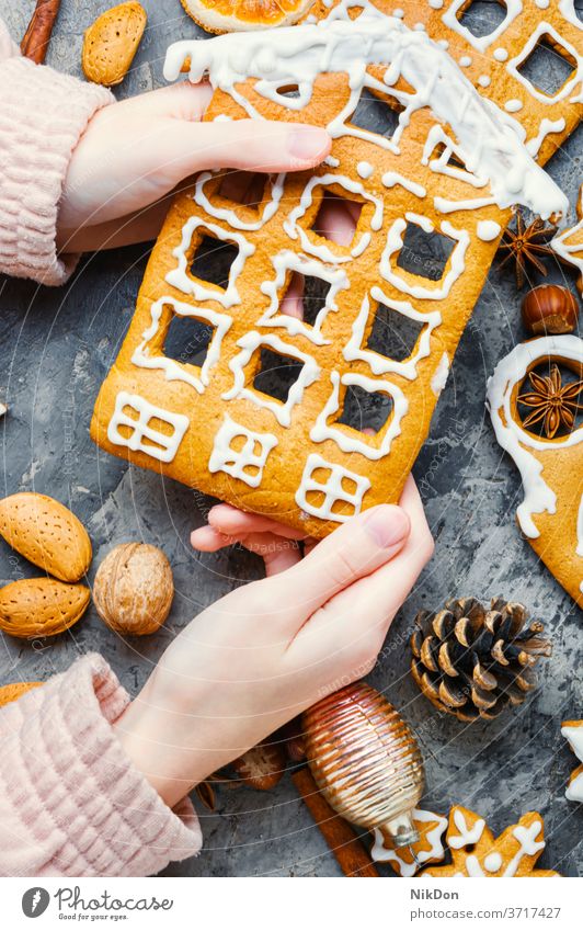 Homemade christmas gingerbread house pastry cookie gingerbread cookie holiday decoration homemade making hand food bake sweet icing snow winter celebration