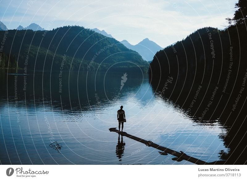 inspirational landscape with a man in the lake watching the mountains and alps Inspiration motivation motivational religion Religion and faith believe nature