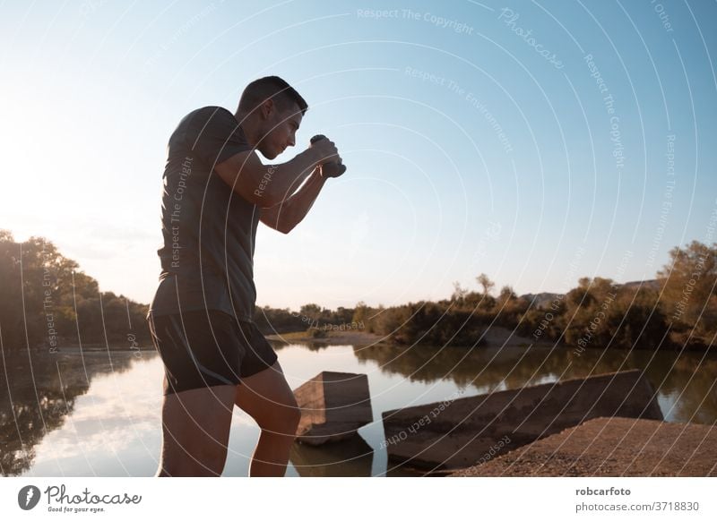 man training next to river male athletic sport jogger bridge healthy workout outdoor lifestyle active athlete sky sporty runner working men fitness exercise