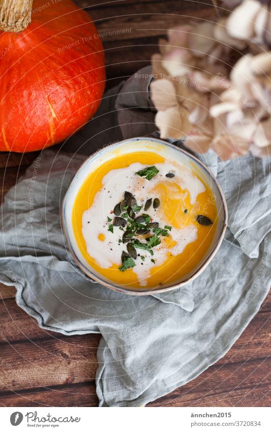 A bowl of pumpkin soup Soup Pumpkin boil Eating Autumn Food Vegetable Vegetarian diet Orange Stew Deserted Healthy Hallowe'en Bowl Colour photo Fresh