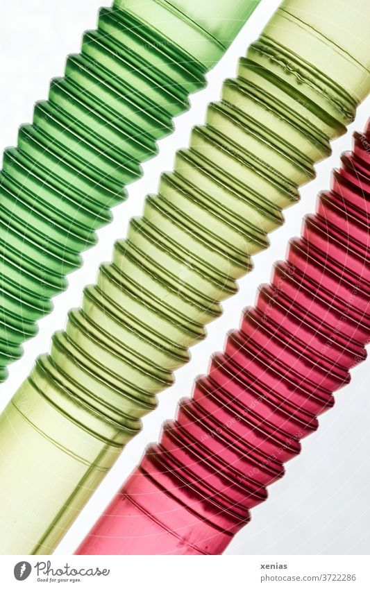 Three tube-like structures in the traffic light colours green, yellow and red - Drinking straws Macro shot reeds Green Red Yellow policy three macro 3 Detail