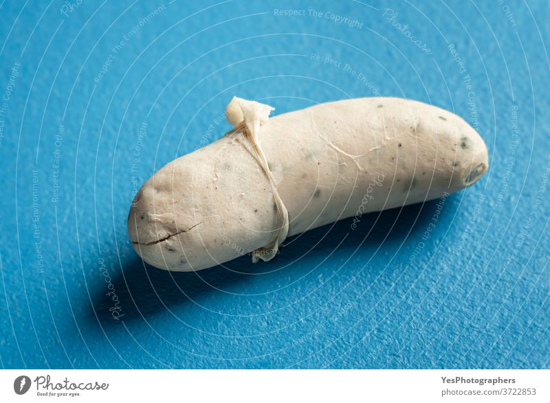 White sausage with peeled skin. German traditional sausage. Bavarian food Germany Oktoberfest background bavarian blue boiled breakfast close-up cooked cooking