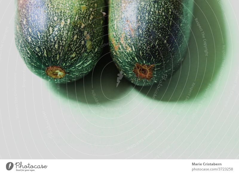 Close up of fresh green zucchini, showing concept of veganism, nutrition and wellness food and nutrition isolated design asset food and wellness