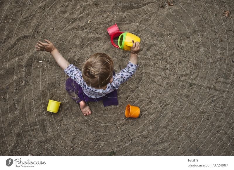 Sand child Sand toys Child Bird's-eye view Playing Toys Sandpit submerged Infancy Trickle Exterior shot Playground Children's game Toddler Day