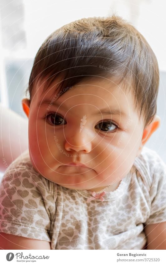 Baby girl arm baby beautiful blanket bright caucasian child cute expressing expression eyes face hand human infant kid little looking month newborn one person