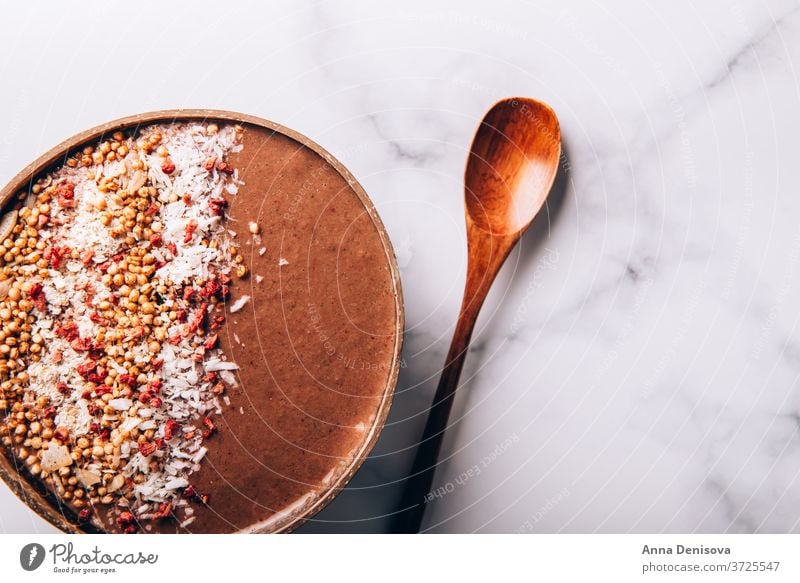 Chocolate Smoothie in Coconut Bowl smoothie chocolate healthy bowl coconut detox banana strawberry raspberry food vegan granola fruit breakfast organic oat