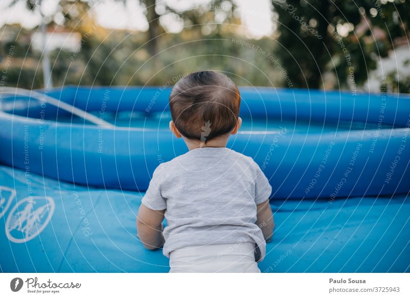 Toddler on the pool Pool border Inflatable Summer Summer vacation Child Baby 0 - 12 months Safety safe Dangerous Playing Beautiful Exterior shot Day Cute