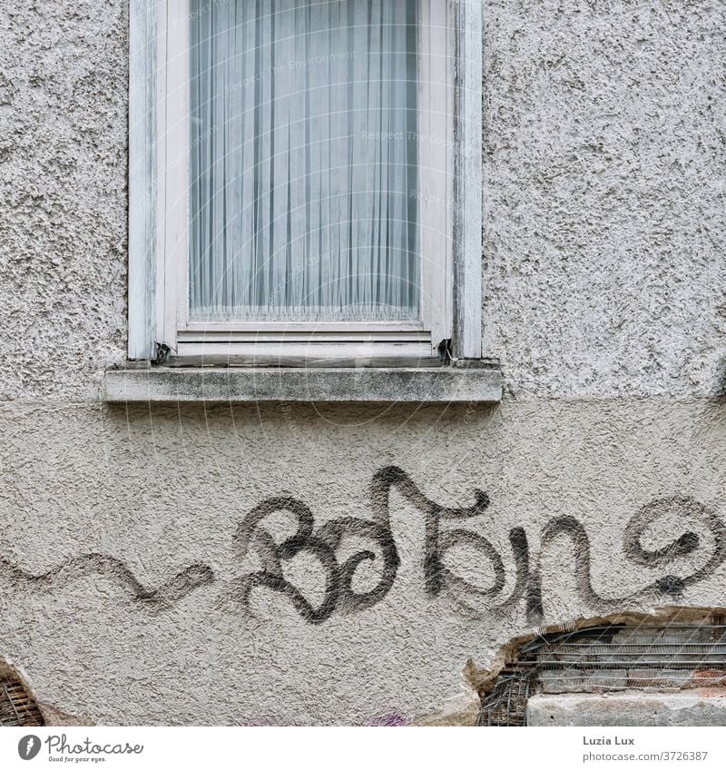 A narrow window with a white curtain, a shabby facade and graffiti Facade Tumbledown Window Drape Curtain Old Windowsill Graffiti Deserted Colour photo