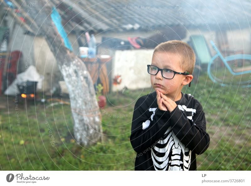 Boy wearing a skeleton costume paying attention to something Boy (child) Wonder Amazed Prayer Faith & Religion Stunned Christianity God Belief Hope Spirituality