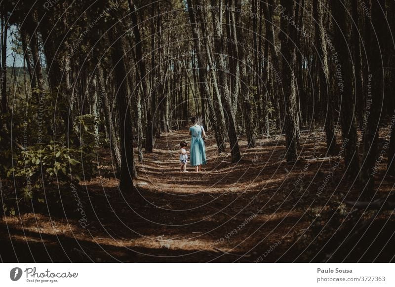 Mother and daughter walking through woods motherhood Daughter Family & Relations Together togetherness Love Adults Happiness Parents Lifestyle people Joy