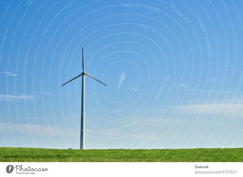 Wind turbine in the field. Wind power energy concept wind generator industry electricity alternative landscape green clean nature renewable environment