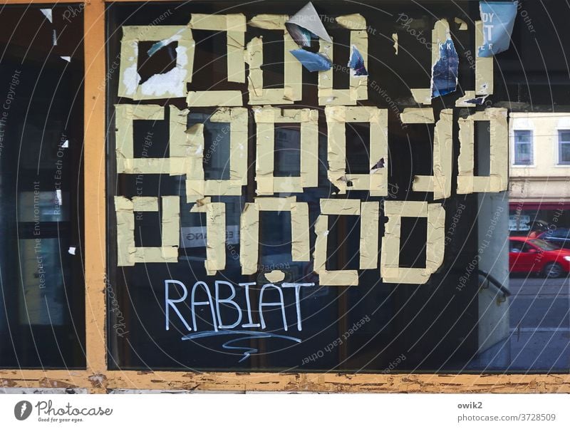 Cipher Shop window Plastered remnants Squares Mysterious reflection Hebrew Unfamiliar Sign Glass RemaindersPaper Adhesive tape adhere Reflection Window puzzling