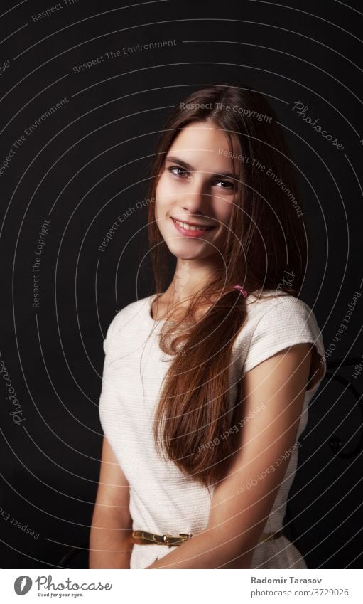 portrait of a beautiful young smiling girl in a bright dress woman smile happy white beauty face caucasian background female pretty people hair adult lady