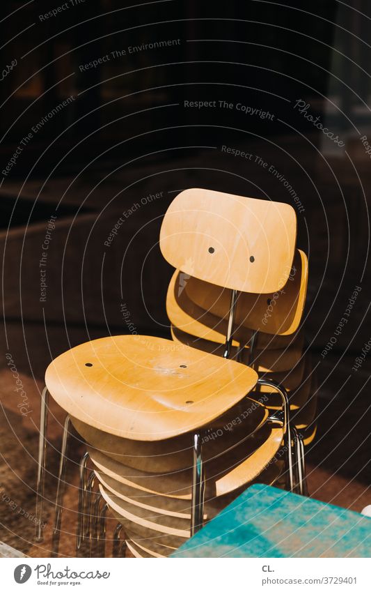 pile of chairs Chair Stack of chairs Furniture Seating Esthetic wood Backrest conceit Space-saving Empty Brown forsake sb./sth. Metal Calm Many Deserted