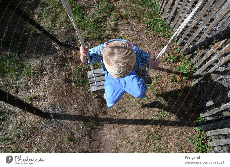 Child on the playground Infancy Boy (child) Swing Playground kita Kindergarten Elementary school grow up Leisure and hobbies To swing Exterior shot Joy Playing