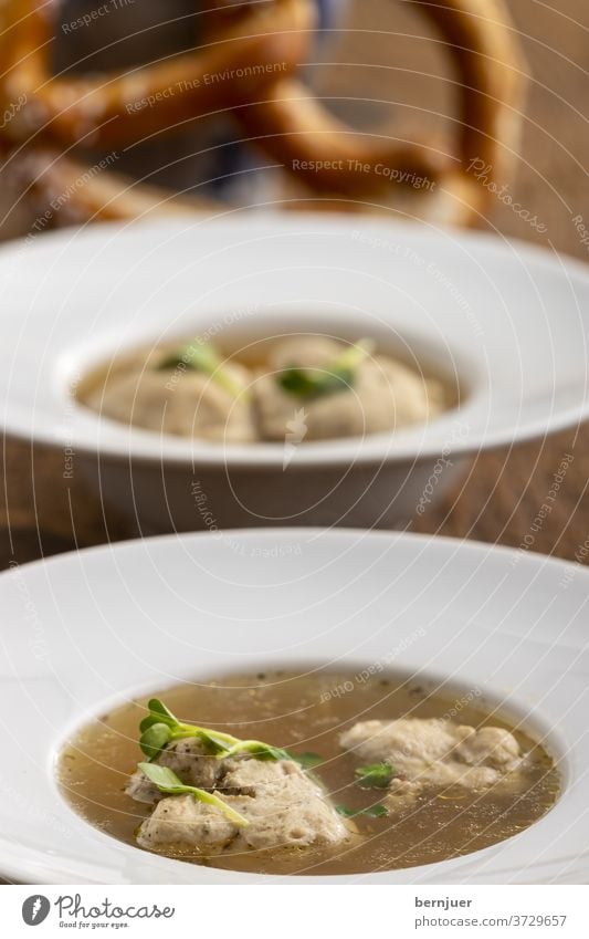 Bavarian meat dumpling in broth on wood Meat dumplings roast fried dumplings Soup Dumpling Stock clear cake Appetizer tribunal Hot Parsley Rustic Bread