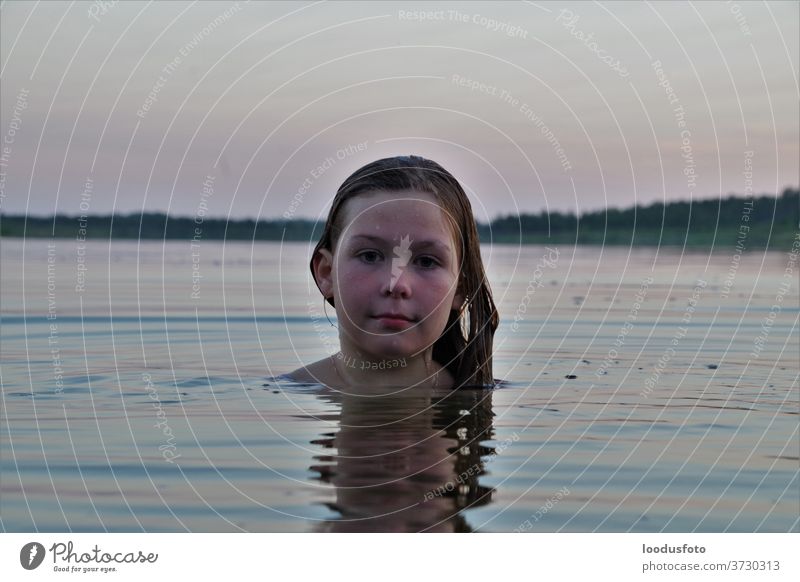 Portrait of girl swimming in the lake water portrait face pretty beautiful selfie wet child fun playing enjoy activity female vacation travel sport cute summer