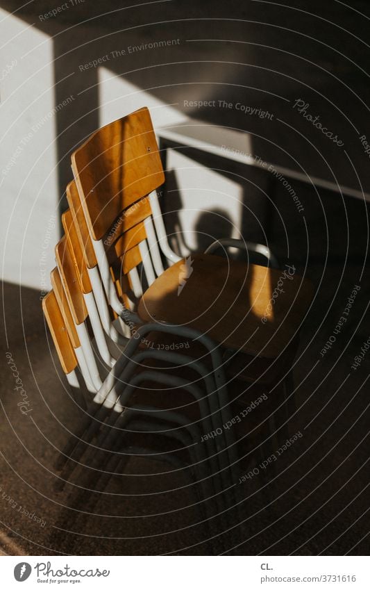 chairs, stacked Chair Stack of chairs Furniture Seating Esthetic wood Backrest Space-saving Empty Brown forsake sb./sth. Calm Deserted Wooden chair Many